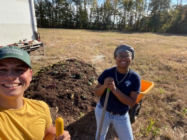 Students posing with garden