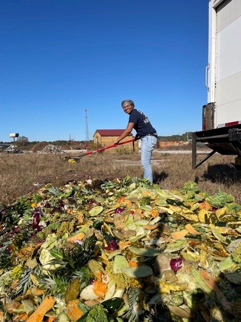 Person spreading compost