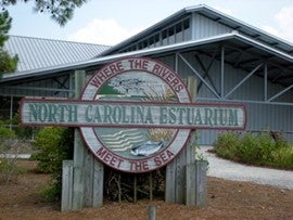 Sign for North Carolina Estuarium. Where the rivers meet the sea.